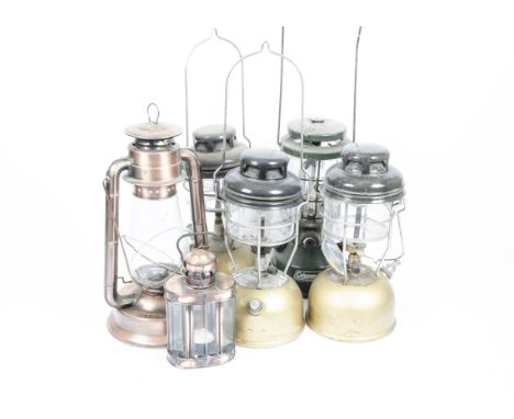 A selection of oil lamps, including a Dietz No.80 blizzard lamp, a Coleman lamp, three by Tilley and one other (6)SAS provide