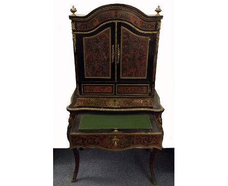 A 19th Century ebonised and marquetry boulle-work bonheur du jour, ormolu mounts, arched panel doors revealing fitted shelf a