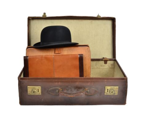 A Dunn & Co. vintage bowler hat, together with a leather suitcase, briefcase and an Italian leather portfolio (4)Hat measurem