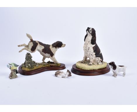 A Beswick Cocker Spaniel no.967 and Blue Tit no.992, together with a Royal Doulton cat, a mounted model of a spaniel by Caith