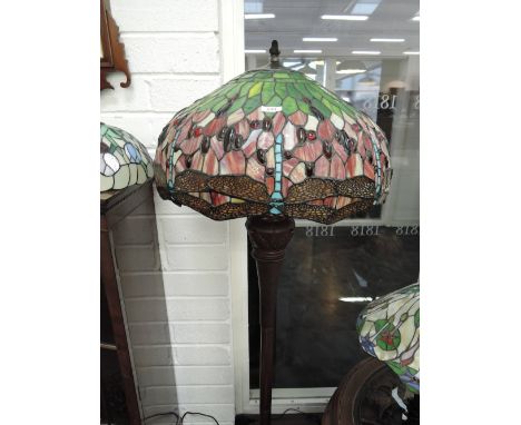 A Tiffany style reproduction standard lamp having stylised shade with dragonfly decoration in green/red 
