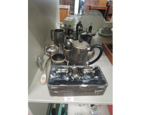 A small selection of plated and pewter items including cased cruet set, tankards tea ware and ladle