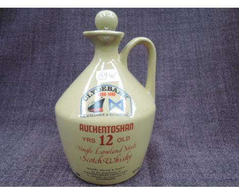 A ceramic decanter of Auchentoshan 12yr old Single Lowland Malt Scotch Whisky