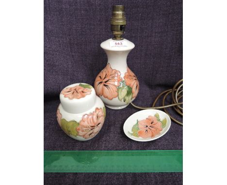 A Moorcroft table lamp in the Hibiscus pattern on cream ground and a similar pattern Moorcroft Ginger jar and trinket tray