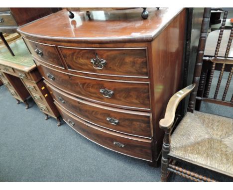 A Victorian mahogany bow front chest of 2 short and 3 long cockbeaded drawers on shaped bracket feet