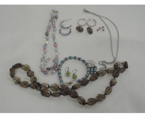 A small selection of jewellery including a pair of ruby stud earrings on 9ct white gold, Pandora silver hoop earrings, Mexica