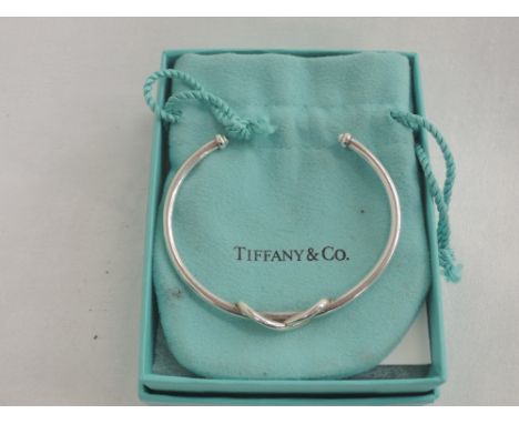 A Tiffany Infinity silver cuff bangle having moulded knot detail