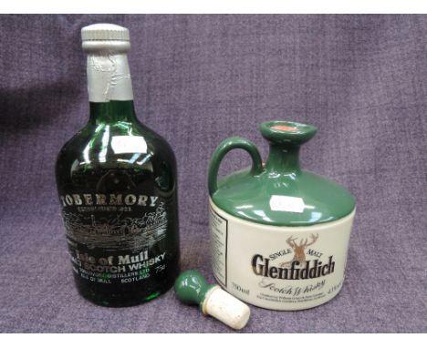 A bottle of Tobermory Isle Of Mull Malt Whisky and a ceramic bottle of Glenfiddich Malt Whisky