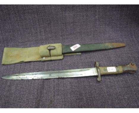 A British Lee-Metford bayonet MKI 1888 with leather scabbard and webbing frog. Marks on blade, 94,95,96,97,98,99