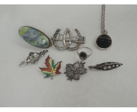 A small selection of HM silver and white metal jewellery including blue john pendant and ring, horse shoe brooch, ceramic bro