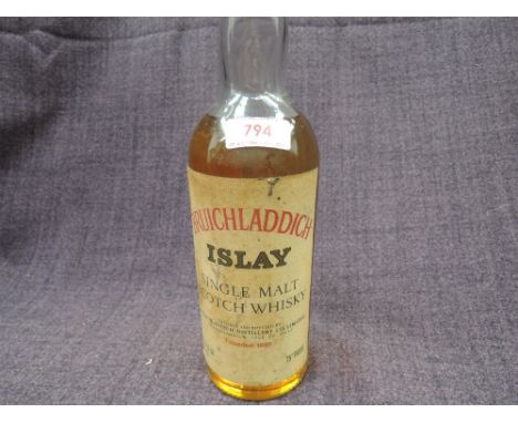 An old bottle of Bruichladdich Islay Single Malt Scotch Whisky, 26.4floz, 75cl and 75% proof