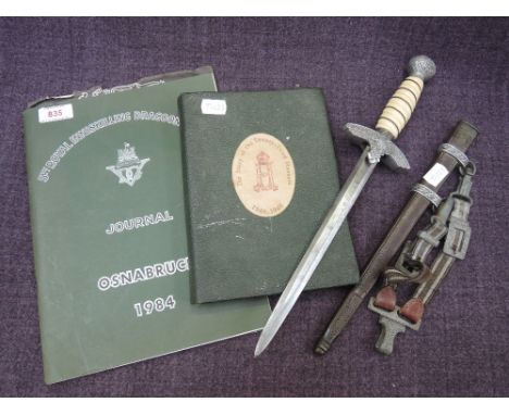 A 2nd pattern German Luftwaffe Flying Officer's dagger with scabbard and hanger, also two military books including the Story 