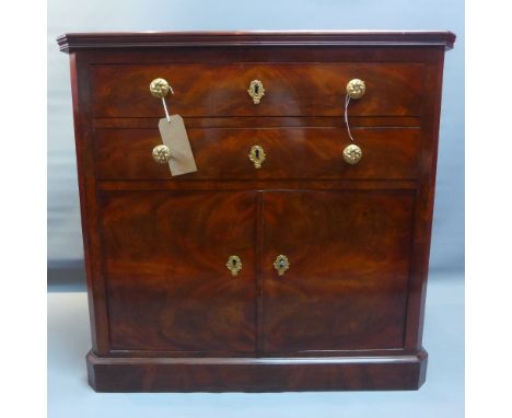 A 19th century French mahogany commode with two drawers above two cupboard doors and raised on plinth base. H-80cm W-82cm D-3