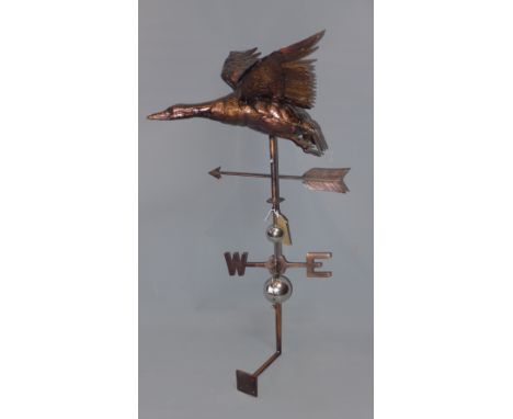 A contemporary sheet metal weather vane with goose finial