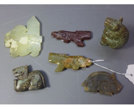 Five Shang style jade pendent's in the form of various animals together with a hardstone figure of a bear.