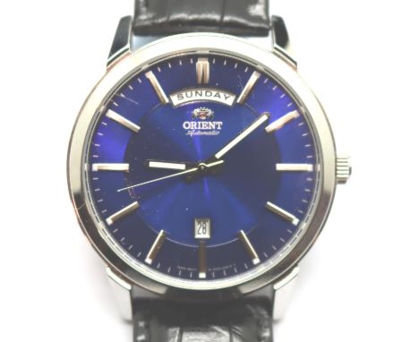 Gents Orient blue dial day and date wristwatch, new and boxed. Dial D: 35 mm. P&amp;P Group 1 (£14+VAT for the first lot and 