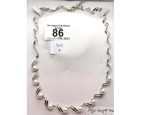 Boxed silver Jersey Pearl mounted necklace. P&amp;P Group 2 (£18+VAT for the first lot and £3+VAT for subsequent lots) 
