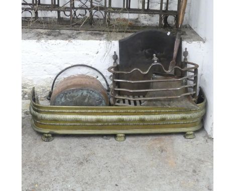 A brass fire surround, length 104cm, copper cauldron, copper kettle, fire grate etc.