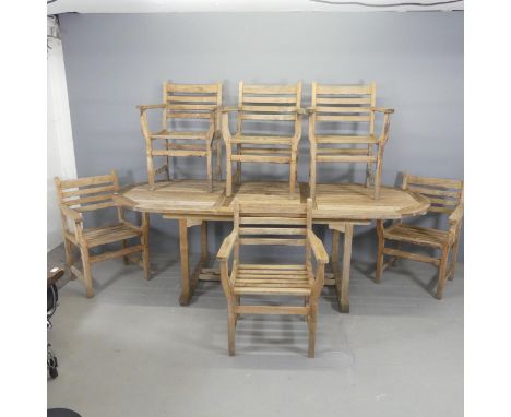 A weathered teak garden dining table, length 239cm, height 74cm, width 100cm, and six matching chairs with lables for Lindsey