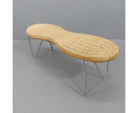 IKEA - a rattan bench in the form of a peanut with hairpin metal legs, 1999, with maker’s label. Length 113cm, height 43cm, w
