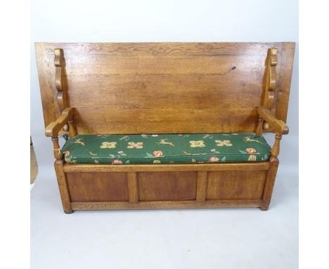 An Antique panelled oak monk's bench with lifting seat, 200cm x 120cm x 60cm, with back folded, 200cm x 76cm x 73cm