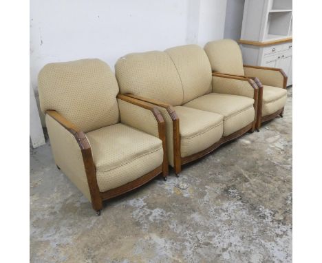 A 1930s oak and upholstered Art Deco three-piece suite, comprising a two seater sofa and two matching arm chairs.Sofa dimensi