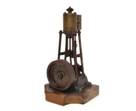 Early 20th century vertical upright steam engine Early 20th century vertical upright steam engine on shaped wooden base22cm h
