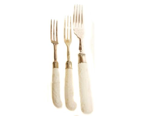 Three Chelsea cutlery handles with later metalwork    Three mid 18th century Chelsea cutlery handles with later metalwork.The