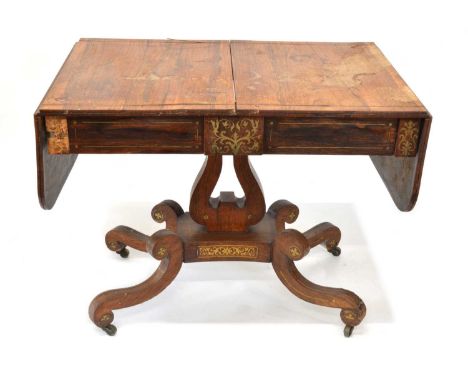 Regency rosewood and brass inlaid sofa table Early 19th century regency rosewood and brass inlaid sofa table, rounded rectang