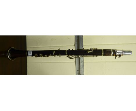 A rosewood and silver plated five piece clarinet       CA