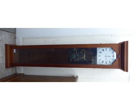 A modern teak cased electric Master clock, faced by a Roman dial  50''h  10''w       CA