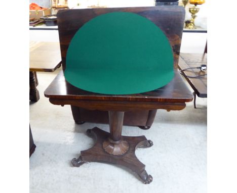 A William IV rosewood card table, the rotating, foldover top raised on a tapered column, an inverted plinth, scrolled feet an