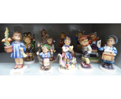 Thirteen Goebel Hummel china figures: to include a young boy delivering letters  4.5''h     OS1