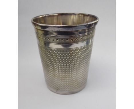 An early 20thC Continental silver beaker with engine turned decoration  bears indistinct marks  boxed       11
