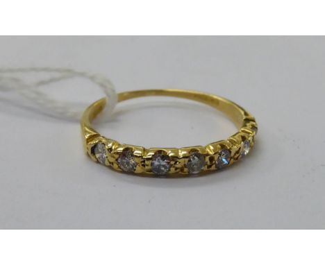 An 18ct gold diamond half-eternity ring       11