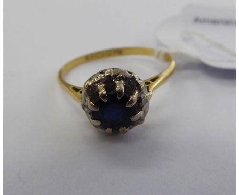 An 18ct gold, sapphire and diamond cluster ring       11