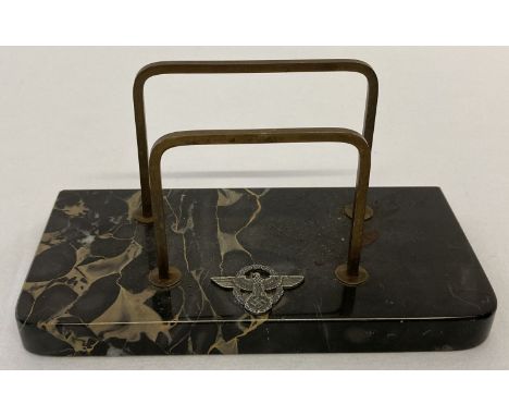 A German WWII style marble based desk letter rack set with metal Nazi Military Police insignia.   Base approx. 16cm x 8cm. Ov