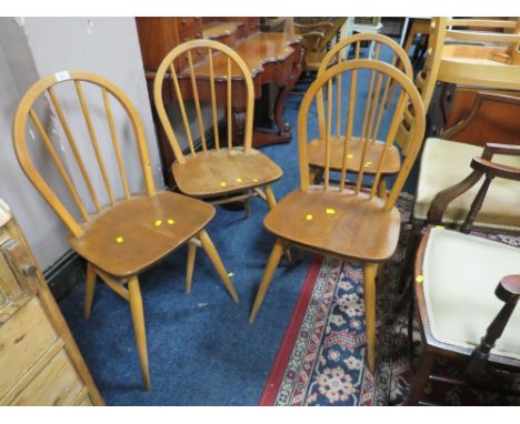 A SET OF FOUR ERCOL STYLE HOOP BACK CHAIRS