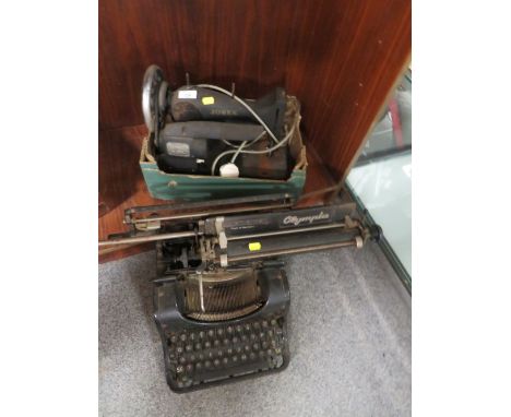 A VINTAGE JONES SEWING MACHINE TOGETHER WITH A VINTAGE OLYMPIA BUROMASCHINENWERKE A.G. ERFURT MOD 8 TYPEWRITER