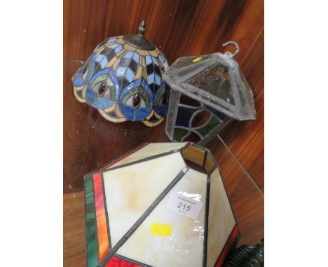 A TIFFANY STYLE LAMP SHADE PLUS ANOTHER AND A LEADED GLASS LANTERN (3)