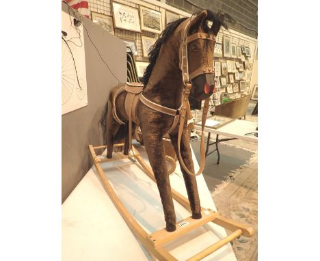 Rocking horse with brown plush hair brown saddle reigns etc