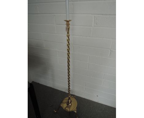 A brass floor lamp