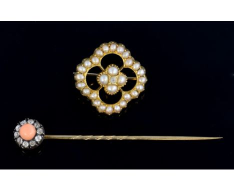  Victorian gold and pearl openwork brooch with central diamond, 2.3  cm, and a coral stick pin with old cut diamonds .   