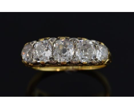  Victorian five stone diamond ring, set with old cut stones, in carved mount, three stones estimated each estimated at 0.50 c