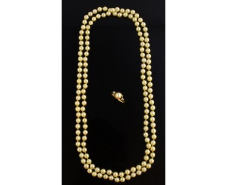 Gold ring with pearl and small diamonds, marked 375, ring size k and a cultured pearl necklace, length 100 cm .   