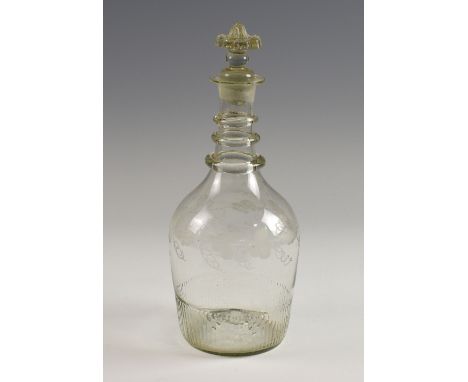 18th century engraved glass three ring neck decanter .  Small chip to the underside of the flower stopper. Small internal fra