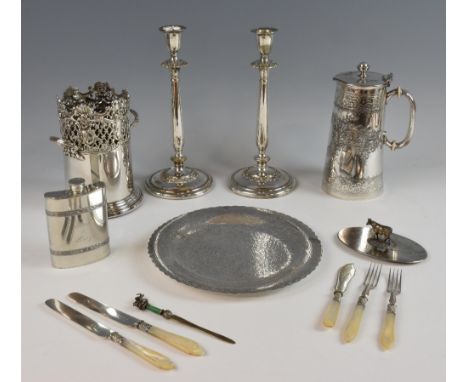 Silver plated bottle holder, pair candle sticks, hot water jug, lid with cow finial, eastern plate,  hip flask and various fl