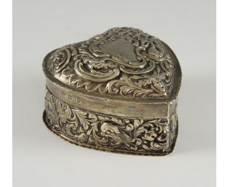 A Victorian silver trinket box by William Comyns & Sons, London, 1896, heart-shaped with embossed scrolls, flowers and birds 