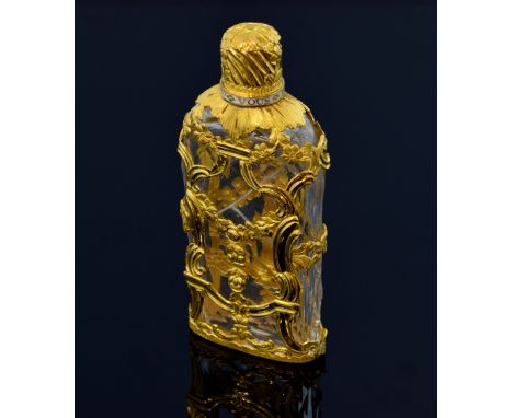 George III gold mounted glass scent bottle, in high carat gold mount, the top with chased decoration and white enamel frieze,