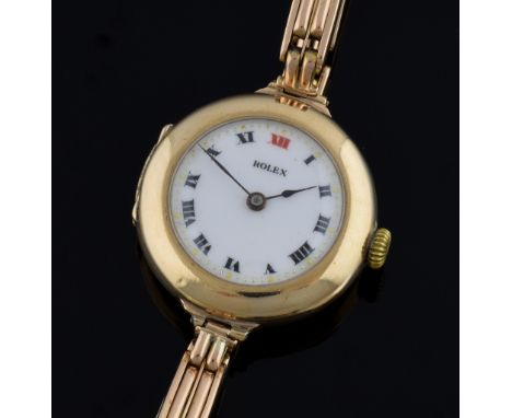 Rolex, ladies 9ct gold cocktail dress watch, white enamel dial with red and black roman numerals on a 9ct gold bracelet, hall